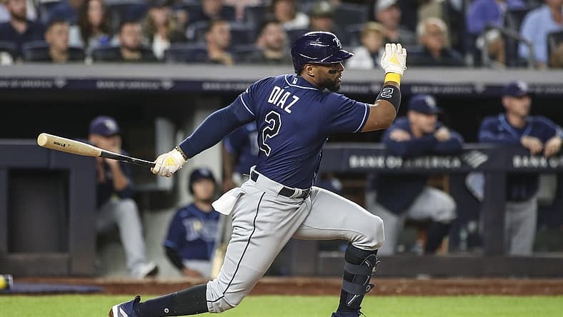 Sep 9, 2022; Bronx, New York, USA; Tampa Bay Rays third baseman Yandy Diaz (2) hits a single in the fourth inning against the New York Yankees at Yankee Stadium. Mandatory Credit: Wendell Cruz-USA TODAY Sports