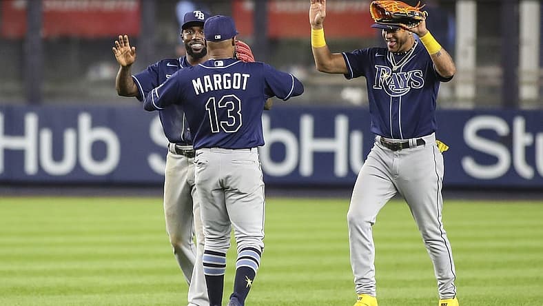 Sep 9, 2022; Bronx, New York, USA;  Tampa Bay Rays outfielders Randy Arozarena (56), Manuel Margot (13) and  Jose Siri (22) celebrate after defeating the New York Yankees 4-2 at Yankee Stadium. Mandatory Credit: Wendell Cruz-USA TODAY Sports