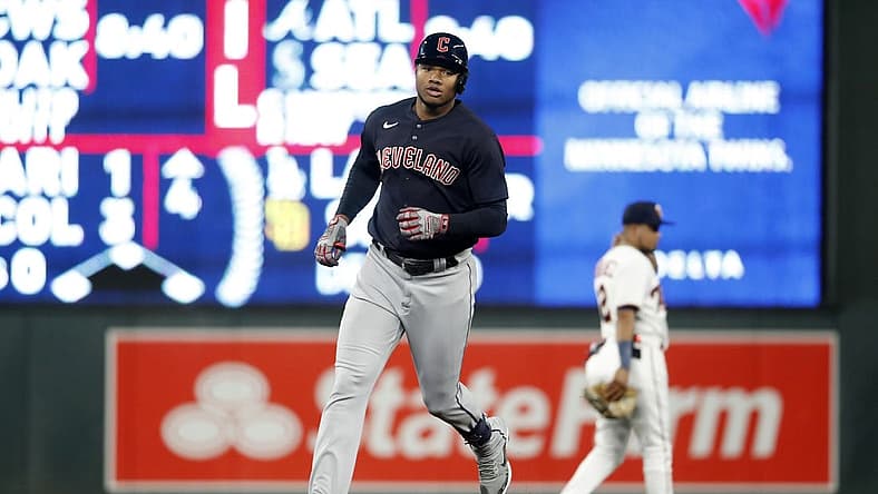 Sep 9, 2022; Minneapolis, Minnesota, USA;  Cleveland Guardians right fielder Oscar Gonzalez (39) hits a home run against Minnesota Twins at Target Field. Mandatory Credit: Bruce Kluckhohn-USA TODAY Sports
