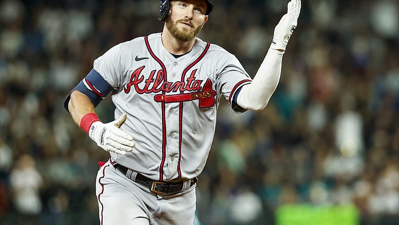 Sep 9, 2022; Seattle, Washington, USA; Atlanta Braves right fielder Robbie Grossman (15) does a tomahawk-chop after hitting a solo-home run against the Seattle Mariners during the sixth inning at T-Mobile Park. Mandatory Credit: Joe Nicholson-USA TODAY Sports