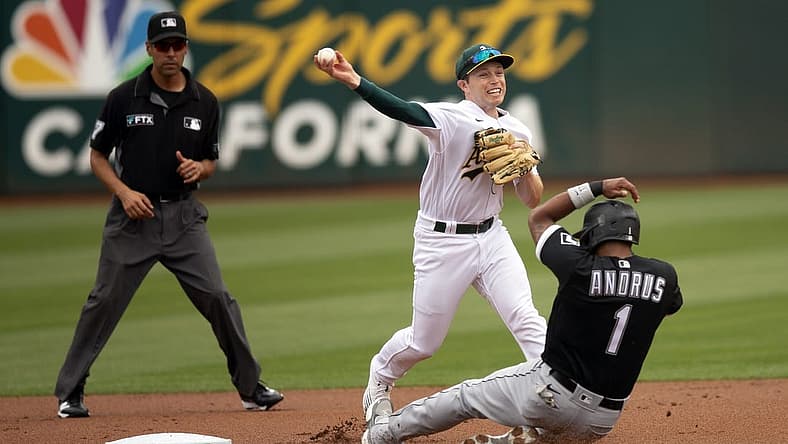 Sep 10, 2022; Oakland, California, USA; Oakland Athletics shortstop Nick Allen (2) throws over Chicago White Sox shortstop Elvis Andrus (1) to complete a double play during the first inning at RingCentral Coliseum. Yoan Moncada was out at first base. Umpire is Gabe Morales. Mandatory Credit: D. Ross Cameron-USA TODAY Sports