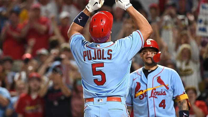 Sep 10, 2022; Pittsburgh, Pennsylvania, USA; St. Louis Cardinals Albert Pujols (5) celebrates near teammate Yadier Molina (4) after hitting a two-run home run against the Pittsburgh Pirates in the sixth inning at PNC Park. It was the career home run 696 for Pujols. Mandatory Credit: Philip G. Pavely-USA TODAY Sports