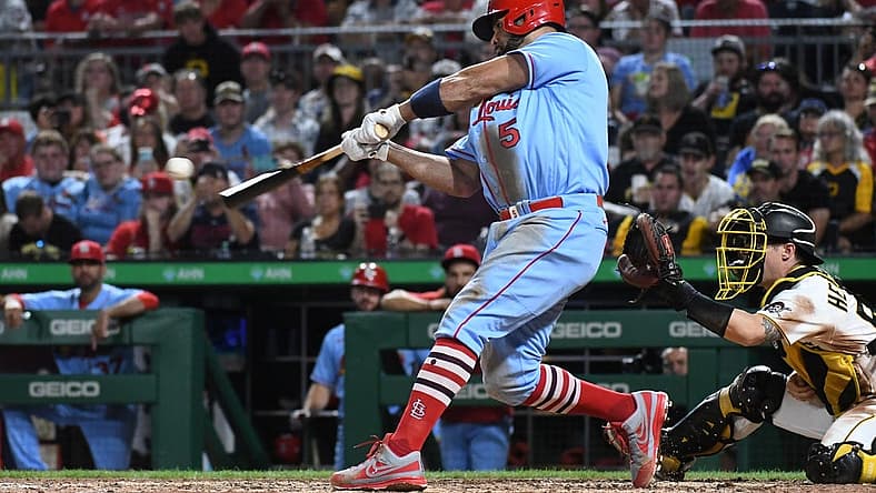 Sep 10, 2022; Pittsburgh, Pennsylvania, USA;  St. Louis Cardinals Albert Pujols (5) hits a two-run home run against the Pittsburgh Pirates in the sixth inning at PNC Park. It was the career home run 696 for Pujols. Mandatory Credit: Philip G. Pavely-USA TODAY Sports