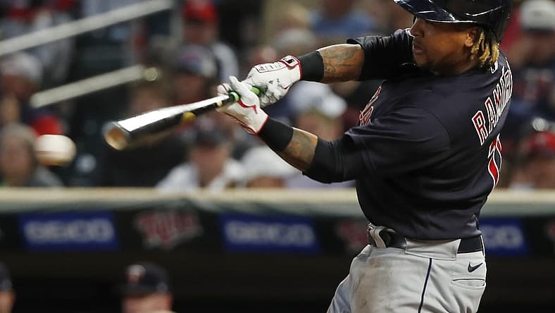 Sep 10, 2022; Minneapolis, Minnesota, USA; Cleveland Guardians third baseman Jose Ramirez (11) hits an RBI single against the Minnesota Twins in the fourth inning at Target Field. Mandatory Credit: Bruce Kluckhohn-USA TODAY Sports