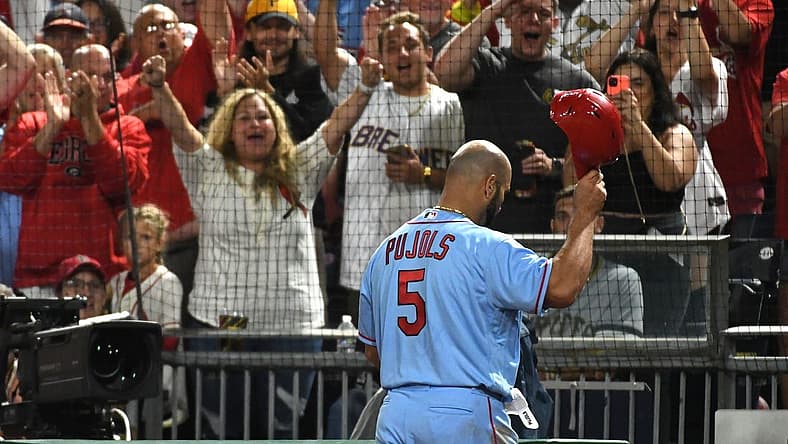 Sep 10, 2022; Pittsburgh, Pennsylvania, USA;  St. Louis Cardinals  Albert Pujols (5) tips his helmet to the crowd after leaving the game against the Pittsburgh Pirates in the eighth inning at PNC Park. Mandatory Credit: Philip G. Pavely-USA TODAY Sports
