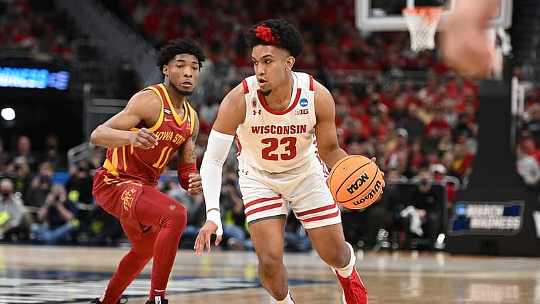 Mar 20, 2022; Milwaukee, WI, USA; Wisconsin Badgers guard Chucky Hepburn (23) drives to the basket against I11 during the first half during the second round of the 2022 NCAA Tournament at Fiserv Forum. Mandatory Credit: Benny Sieu-USA TODAY Sports