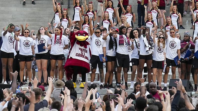 Apr 13, 2022; Columbia, SC, USA; The South Carolina Gamecocks women s basketball team during the playing of the school song as they hold their hands in the air in the shape of a C during their championship parade. Mandatory Credit: Jim Dedmon-USA TODAY Sports