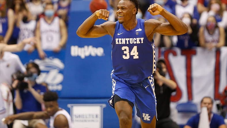 Kentucky forward Oscar Tshiebwe (34) flexes after scoring over Kansas during the second half of Saturday's game inside Allen Fieldhouse.
Oscar Tshiebwe Kansas