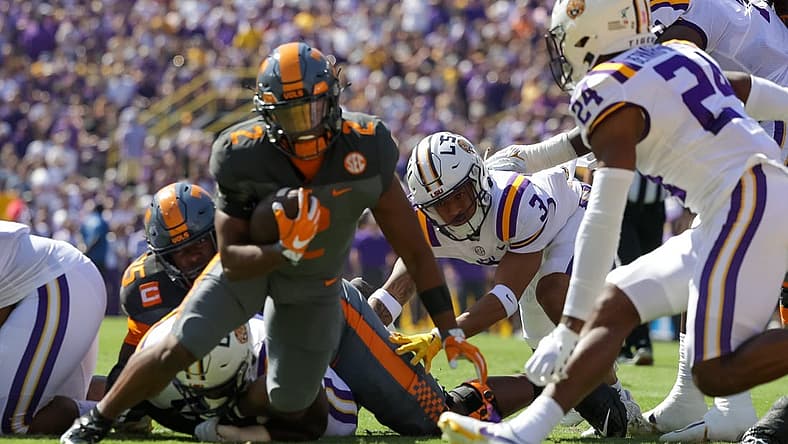 Oct 8, 2022; Baton Rouge, Louisiana, USA; Tennessee Volunteers running back Jabari Small (2) is tackled by LSU Tigers cornerback Jarrick Bernard-Converse (24) during the first half at Tiger Stadium. Mandatory Credit: Stephen Lew-USA TODAY Sports