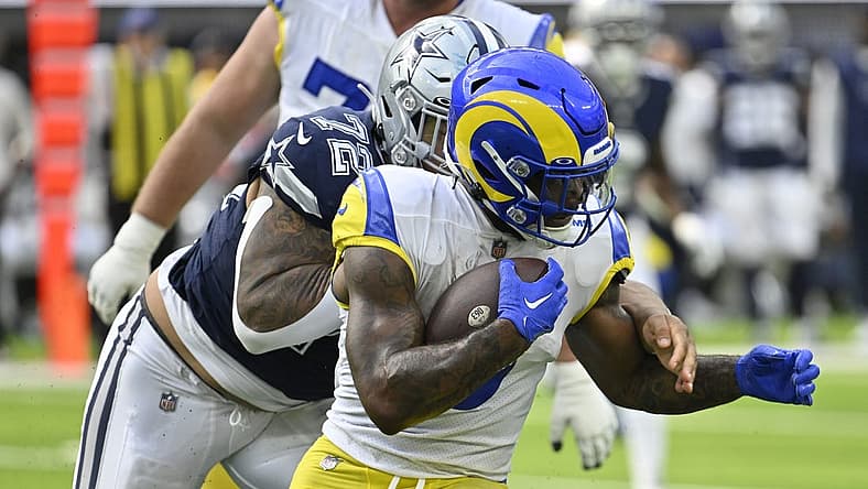 Oct 9, 2022; Inglewood, California, USA; Los Angeles Rams running back Cam Akers (3) is grabbed from behind by Dallas Cowboys defensive tackle Trysten Hill (72) during the second quarter at SoFi Stadium. Mandatory Credit: Robert Hanashiro-USA TODAY Sports