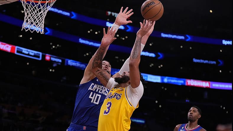 Oct 20, 2022; Los Angeles, California, USA; Los Angeles Lakers forward Anthony Davis (3) shoots the ball against LA Clippers center Ivica Zubac (40) in the first half at Crypto.com Arena. Mandatory Credit: Kirby Lee-USA TODAY Sports