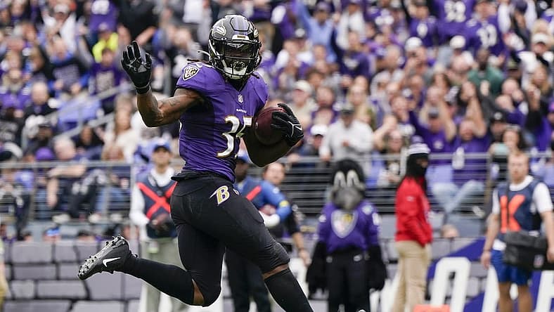 Oct 23, 2022; Baltimore, Maryland, USA; Baltimore Ravens running back Gus Edwards (35) scores a touchdown against the Cleveland Browns during the first half at M&T Bank Stadium. Mandatory Credit: Jessica Rapfogel-USA TODAY Sports