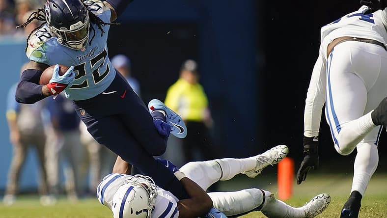 Oct 23, 2022; Nashville, Tennessee, USA; Tennessee Titans running back Derrick Henry (22) is tackled by Indianapolis Colts linebacker E.J. Speed (45) during the third quarter at Nissan Stadium Sunday, Oct. 23, 2022, in Nashville, Tenn. Mandatory Credit: Andrew Nelles-USA TODAY Sports