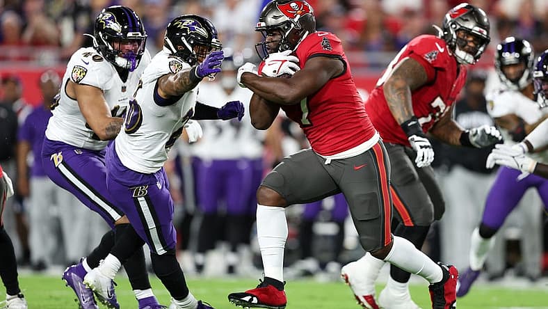 Oct 27, 2022; Tampa, Florida, USA; Tampa Bay Buccaneers running back Leonard Fournette (7) runs with the ball against the Baltimore Ravens in the first quarter at Raymond James Stadium. Mandatory Credit: Nathan Ray Seebeck-USA TODAY Sports