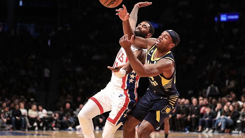Oct 29, 2022; Brooklyn, New York, USA; Brooklyn Nets guard Kyrie Irving (11) and Indiana Pacers guard Buddy Hield (24) fight for a loose ball in the second quarter at Barclays Center. Mandatory Credit: Wendell Cruz-USA TODAY Sports