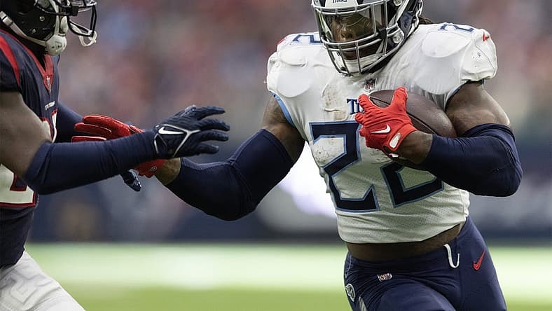 Oct 30, 2022; Houston, Texas, USA; Tennessee Titans running back Derrick Henry (22) rushes for a touchdown against Houston Texans cornerback Desmond King II (25) in the second quarter at NRG Stadium. Mandatory Credit: Thomas Shea-USA TODAY Sports