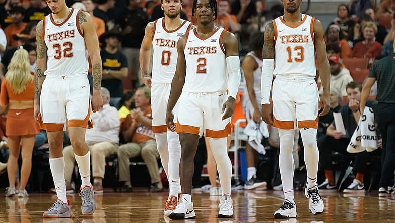 Nov 9, 2021; Austin, Texas, USA; Texas Longhorns forwards Christian Bishop (32) and Timmy Allen (0) along with guards Marcus Carr (2) and Jase Febres (13) during the first half against the Houston Baptist Huskies at Frank C. Erwin Jr. Center. Mandatory Credit: Scott Wachter-USA TODAY Sports