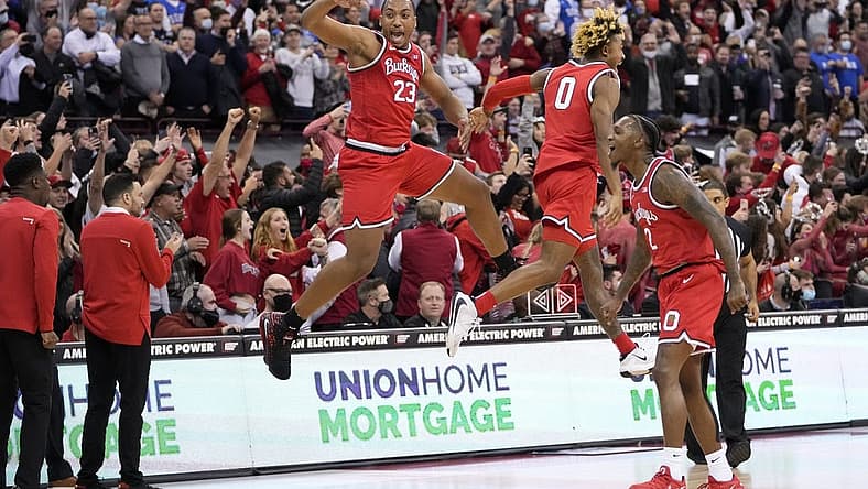 Ohio State Buckeyes forward Zed Key (23) celebrates with guard Meechie Johnson Jr. (0) and guard Cedric Russell (2) following their 71-66 win over the Duke Blue Devils in the NCAA men's basketball game at Value City Arena in Columbus on Wednesday, Dec. 1, 2021.
Duke At Ohio State Big Ten Acc Challenge