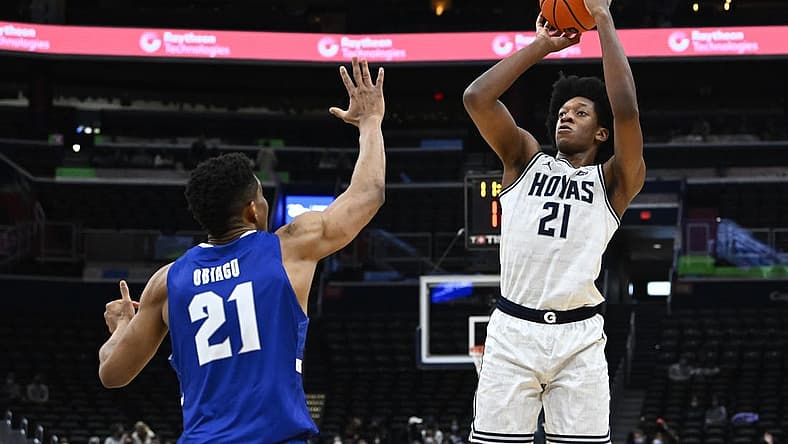 Feb 1, 2022; Washington, District of Columbia, USA; Georgetown Hoyas center Ryan Mutombo (21) shoots as Seton Hall Pirates center Ike Obiagu (21) during the second half at Capital One Arena. Mandatory Credit: Brad Mills-USA TODAY Sports