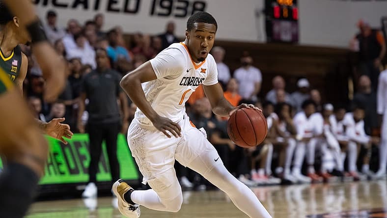 Feb 21, 2022; Stillwater, Oklahoma, USA; Oklahoma State Cowboys guard Bryce Thompson (1) dribbles against the Baylor Bears during the first half at Gallagher-Iba Arena. Mandatory Credit: Rob Ferguson-USA TODAY Sports
