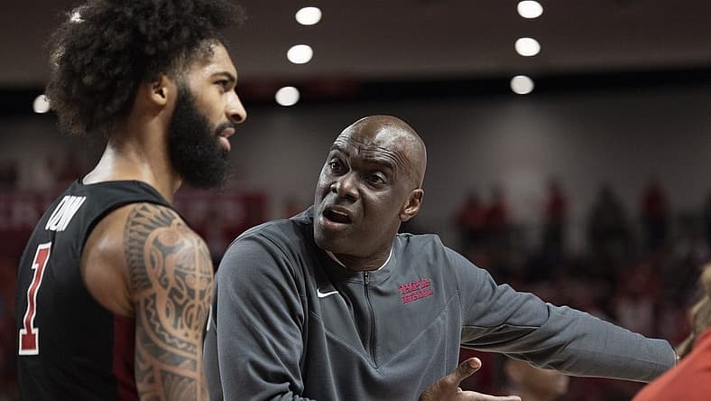 Mar 3, 2022; Houston, Texas, USA; Temple Owls head coach Aaron McKie talks to guard Damian Dunn (1) during a Houston Cougars time-out  in the first half at Fertitta Center. Mandatory Credit: Thomas Shea-USA TODAY Sports