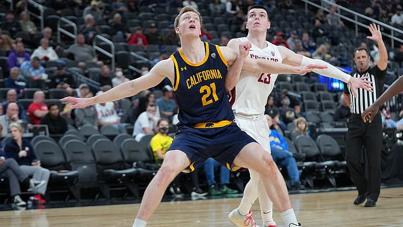 Mar 9, 2022; Las Vegas, Nevada, USA; California Golden Bears forward Lars Thiemann (21) blocks out Washington State Cougars forward Andrej Jakimovski (23) during the second half at T-Mobile Arena. Mandatory Credit: Stephen R. Sylvanie-USA TODAY Sports