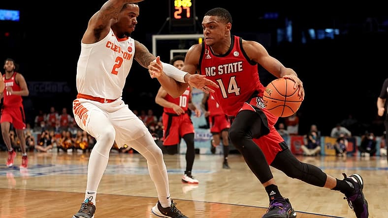 Mar 8, 2022; Brooklyn, NY, USA; North Carolina State Wolfpack guard Casey Morsell (14) drives to the basket against Clemson Tigers guard Al-Amir Dawes (2) during the second half at Barclays Center. Mandatory Credit: Brad Penner-USA TODAY Sports