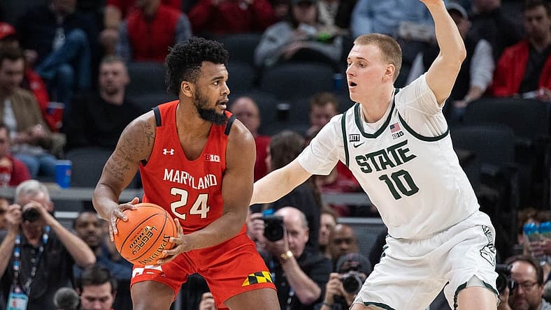 Mar 10, 2022; Indianapolis, IN, USA; Maryland Terrapins forward Donta Scott (24) controls the ball the ball while Michigan State Spartans forward Joey Hauser (10) defends in the second half at Gainbridge Fieldhouse. Mandatory Credit: Trevor Ruszkowski-USA TODAY Sports