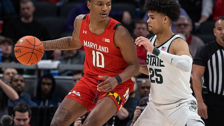 Mar 10, 2022; Indianapolis, IN, USA; Maryland Terrapins forward Julian Reese (10) dribbles the ball while Michigan State Spartans forward Malik Hall (25) defends in the second half at Gainbridge Fieldhouse. Mandatory Credit: Trevor Ruszkowski-USA TODAY Sports