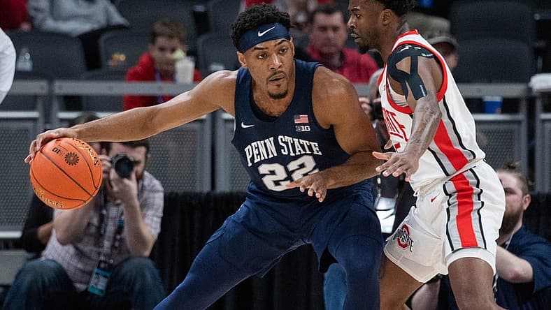 Mar 10, 2022; Indianapolis, IN, USA; Penn State Nittany Lions guard Jalen Pickett (22) dribbles the ball while Ohio State Buckeyes guard Jamari Wheeler (55) defends in the first half at Gainbridge Fieldhouse. Mandatory Credit: Trevor Ruszkowski-USA TODAY Sports