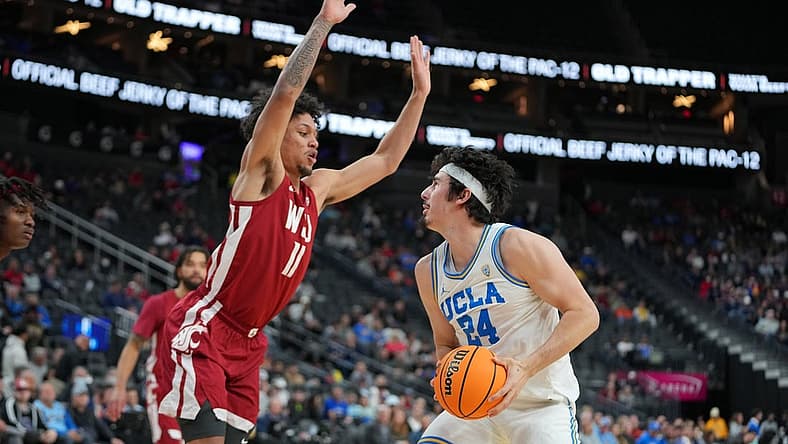 Mar 10, 2022; Las Vegas, NV, USA; Washington State Cougars forward DJ Rodman (11) defends against UCLA Bruins guard Jaime Jaquez Jr. (24) during the first half at T-Mobile Arena. Mandatory Credit: Stephen R. Sylvanie-USA TODAY Sports