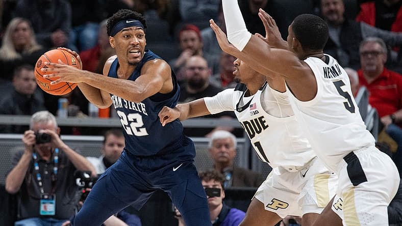 Mar 11, 2022; Indianapolis, IN, USA; Penn State Nittany Lions guard Jalen Pickett (22) looks to pass the ball while Purdue Boilermakers players defend in the second half at Gainbridge Fieldhouse. Mandatory Credit: Trevor Ruszkowski-USA TODAY Sports