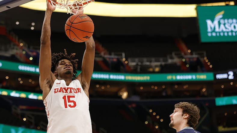 Mar 12, 2022; Washington, D.C., USA; Dayton Flyers forward DaRon Holmes II (15) dunks the ball as Richmond Spiders forward Matt Grace (15) looks on in the second half at Capital One Arena. Mandatory Credit: Geoff Burke-USA TODAY Sports