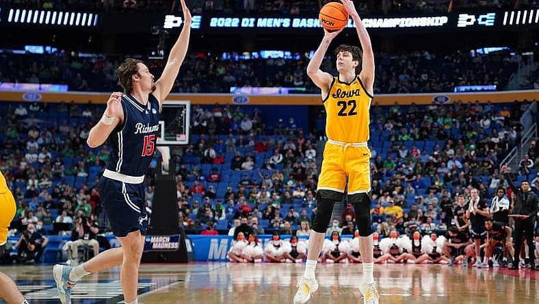 Mar 17, 2022; Buffalo, NY, USA; Iowa Hawkeyes forward Patrick McCaffery (22) shoots the ball against Richmond Spiders forward Matt Grace (15) in the second half during the first round of the 2022 NCAA Tournament at KeyBank Center. Mandatory Credit: Gregory Fisher-USA TODAY Sports