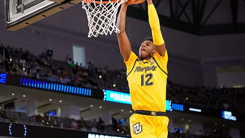 Mar 17, 2022; Fort Worth, TX, USA; Marquette Golden Eagles forward Olivier-Maxence Prosper (12) shoots the ball against the North Carolina Tar Heels during the second half during the first round of the 2022 NCAA Tournament at Dickies Arena. Mandatory Credit: Chris Jones-USA TODAY Sports