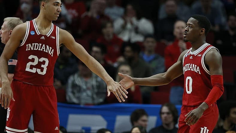 Mar 17, 2022; Portland, OR, USA; Indiana Hoosiers forward Trayce Jackson-Davis (23) and guard Xavier Johnson (0) high-five against the Saint Mary's Gaels during the first half during the first round of the 2022 NCAA Tournament at Moda Center. Mandatory Credit: Soobum Im-USA TODAY Sports