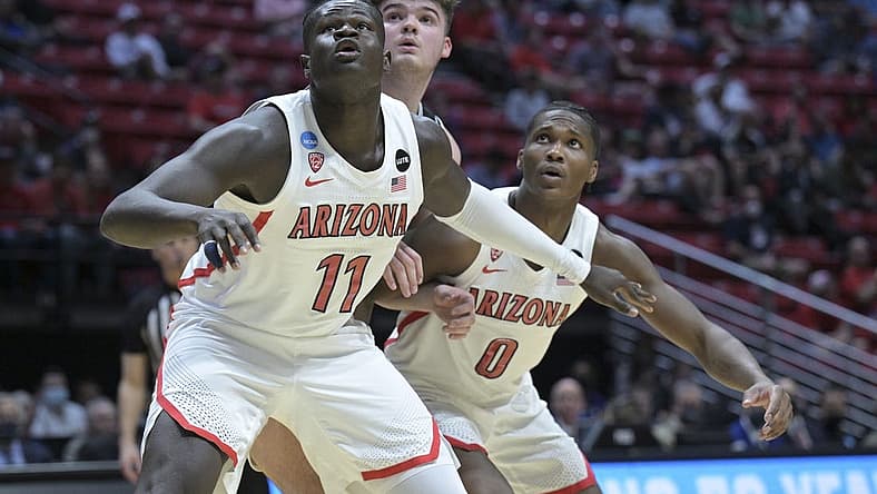 Mar 18, 2022; San Diego, CA, USA; Arizona Wildcats center Oumar Ballo (11) and guard Bennedict Mathurin (0) box out Wright State Raiders forward Grant Basile (00) during the first half during the first round of the 2022 NCAA Tournament at Viejas Arena. Mandatory Credit: Orlando Ramirez-USA TODAY Sports