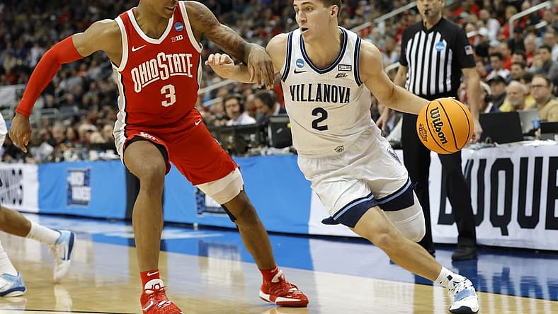 Mar 20, 2022; Pittsburgh, PA, USA; Villanova Wildcats guard Collin Gillespie (2) dribbles the ball past Ohio State Buckeyes guard Eugene Brown III (3) in the second half during the second round of the 2022 NCAA Tournament at PPG Paints Arena. Mandatory Credit: Geoff Burke-USA TODAY Sports