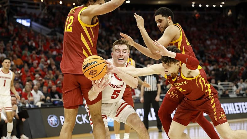 Mar 20, 2022; Milwaukee, WI, USA; Wisconsin Badgers forward Tyler Wahl (5) tries to gain control of the ball against Iowa State Cyclones forward Robert Jones (12) and Iowa State Cyclones guard Caleb Grill (2) during the second half in the second round of the 2022 NCAA Tournament at Fiserv Forum. Mandatory Credit: Jeff Hanisch-USA TODAY Sports