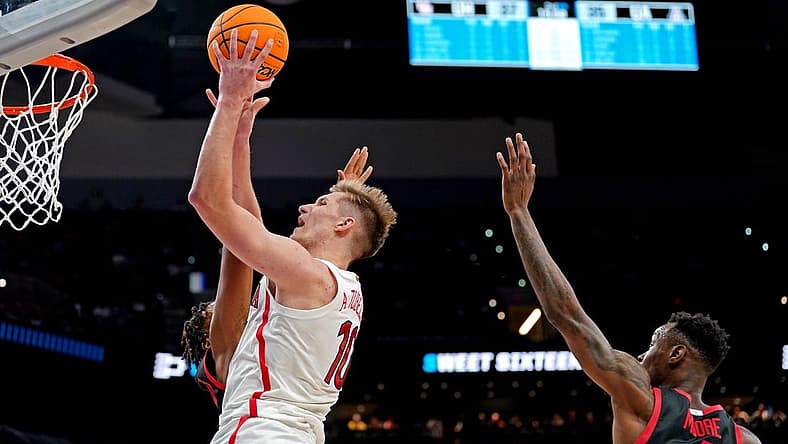 Mar 24, 2022; San Antonio, TX, USA; Arizona Wildcats forward Azuolas Tubelis (10) shoots the ball against Houston Cougars guard Taze Moore (4) during the second half in the semifinals of the South regional of the men's college basketball NCAA Tournament at AT&T Center. Mandatory Credit: Daniel Dunn-USA TODAY Sports