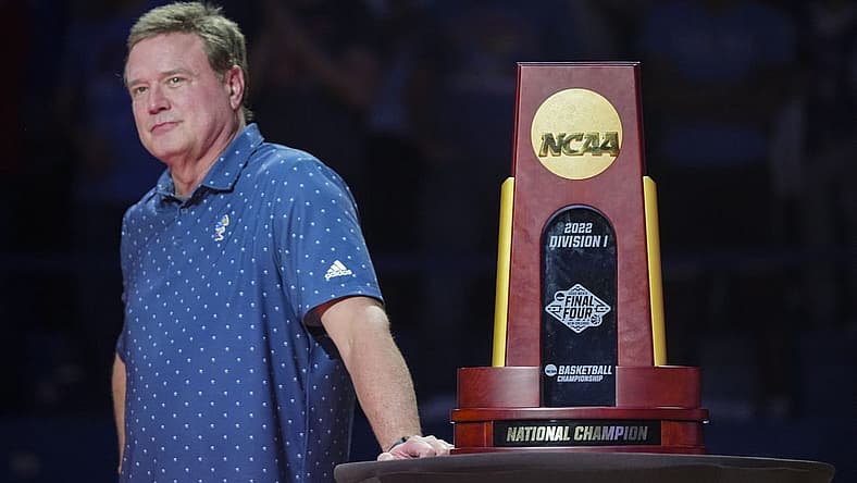 Oct 14, 2022; Lawrence, Kansas, US; Kansas Jayhawks head coach Bill Self stands next to the 2022 NCAA National Championship Trophy during Late Night at the Phog at Allen Fieldhouse. Mandatory Credit: Jay Biggerstaff-USA TODAY Sports