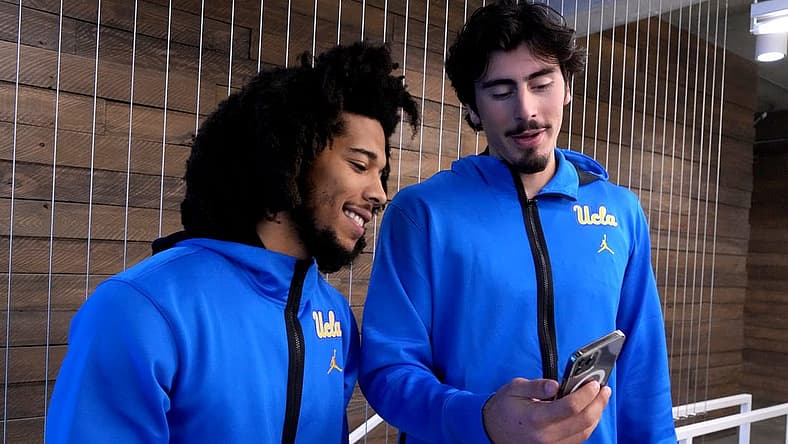 Oct 26, 2022; San Francisco, CA, USA; UCLA Bruins guard Tyger Campbell (left) and forward Jaime Jaquez Jr. react during Pac-12 Media Day at Pac-12 Network Studios. Mandatory Credit: Kirby Lee-USA TODAY Sports