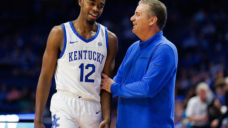 Nov 3, 2022; Lexington, Kentucky, USA; Kentucky Wildcats guard Antonio Reeves (12) talks with head coach John Calipari during the second half against the Kentucky State Thoroughbreds at Rupp Arena at Central Bank Center. Mandatory Credit: Jordan Prather-USA TODAY Sports