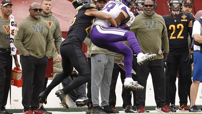 Nov 6, 2022; Landover, Maryland, USA; Minnesota Vikings wide receiver Justin Jefferson (18) catches a pass in front of Washington Commanders cornerback Benjamin St-Juste (25) during the first quarter at FedExField. Mandatory Credit: Geoff Burke-USA TODAY Sports