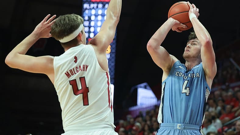 Nov 7, 2022; Piscataway, New Jersey, USA; Columbia Lions forward Liam Murphy (4) shoots the ball as Rutgers Scarlet Knights guard Paul Mulcahy (4) defends during the first half at Jersey Mike's Arena. Mandatory Credit: Vincent Carchietta-USA TODAY Sports
