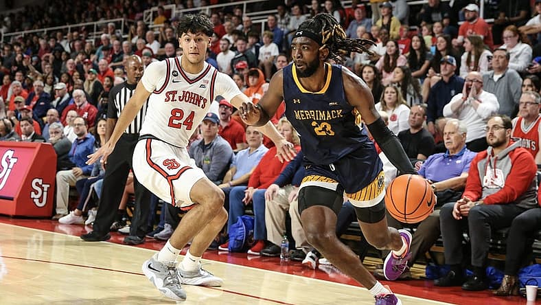 Nov 7, 2022; Queens, New York, USA; of Merrimack Warriors guard Ziggy Reid (23) drives past St. John's Red Storm guard Rafael Pinzon (24) in the first half at Carnesecca Arena. Mandatory Credit: Wendell Cruz-USA TODAY Sports