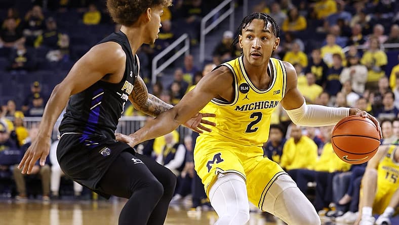 Nov 7, 2022; Ann Arbor, Michigan, USA; Michigan Wolverines guard Kobe Bufkin (2) dribbles defended by IPFW Mastodons guard Quinton Morton-Robertson (11) in the first half at Crisler Center. Mandatory Credit: Rick Osentoski-USA TODAY Sports