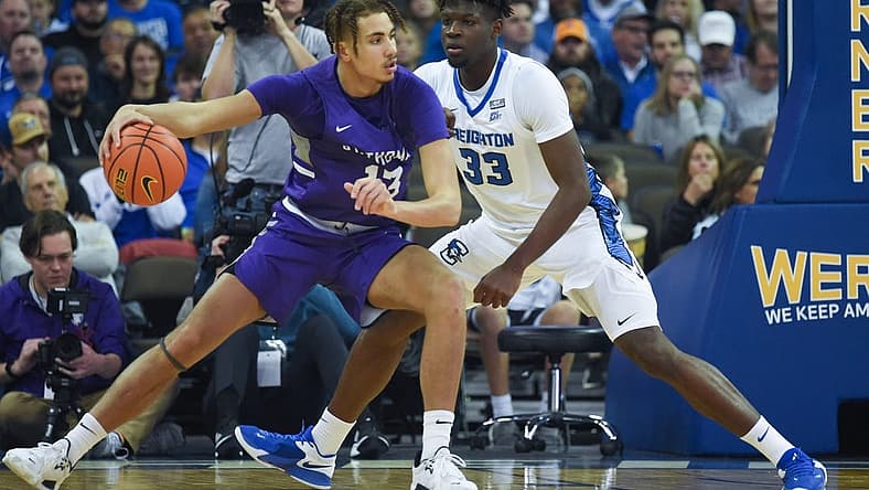 Nov 7, 2022; Omaha, Nebraska, USA; St. Thomas - Minnesota Tommies forward Ahjany Lee (13) drives against Creighton Bluejays center Fredrick King (33) during the first half at CHI Health Center Omaha. Mandatory Credit: Steven Branscombe-USA TODAY Sports
