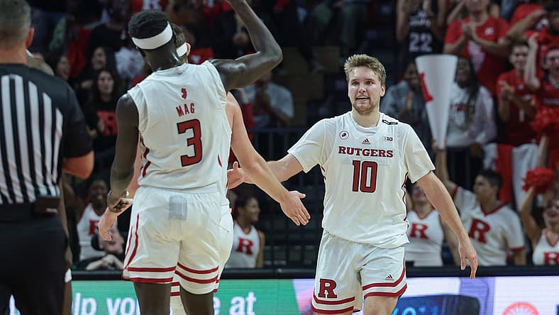 Nov 7, 2022; Piscataway, New Jersey, USA; Rutgers Scarlet Knights guard Cam Spencer (10) is congratulated by teammates after a basket against the Columbia Lions during the second half at Jersey Mike's Arena. Mandatory Credit: Vincent Carchietta-USA TODAY Sports