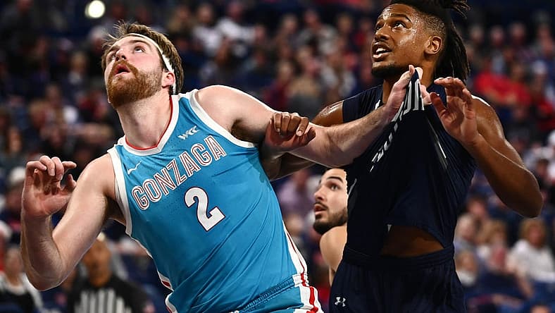 Nov 7, 2022; Spokane, Washington, USA; Gonzaga Bulldogs forward Drew Timme, left, grabs the jersey of North Florida Ospreys guard Chaz Lanier (2) in the first half at McCarthey Athletic Center. Mandatory Credit: James Snook-USA TODAY Sports